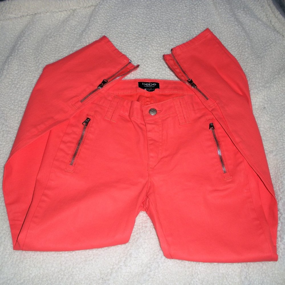 Vintage BEBE orange coated flying B NWT Front zipper accents skinny jeans.